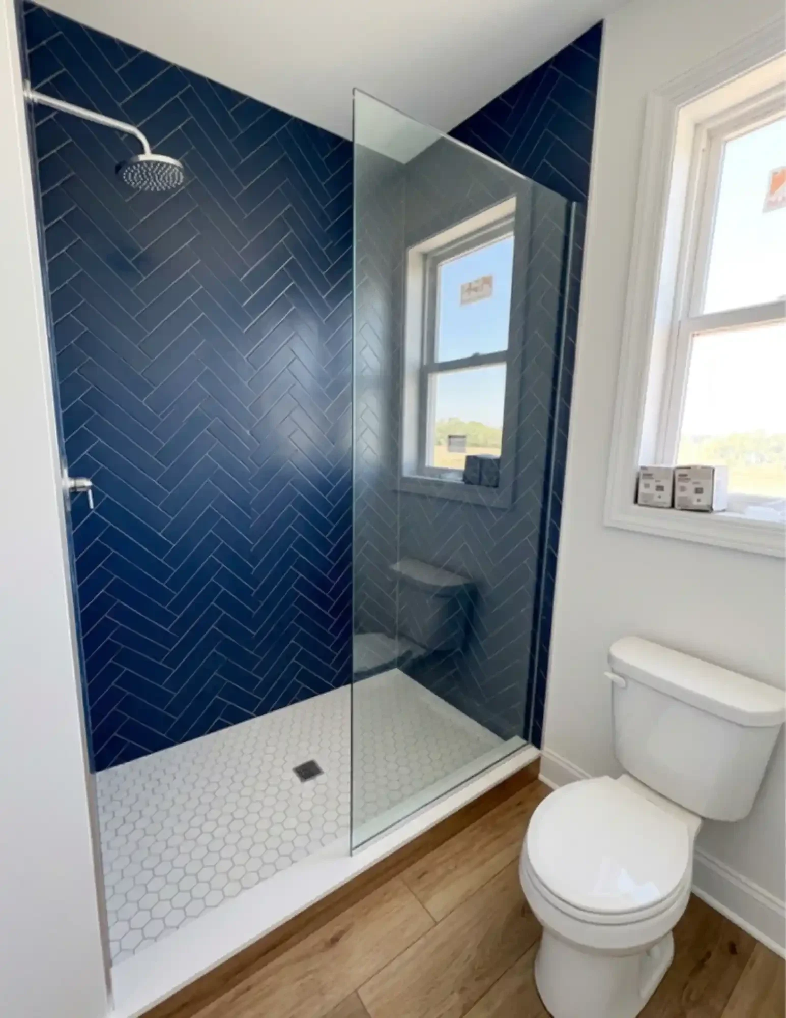 blue herringbone tile patternon walk-in shower bathroom upgrade