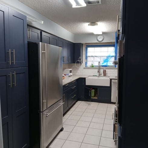 blue cabinets and white walls