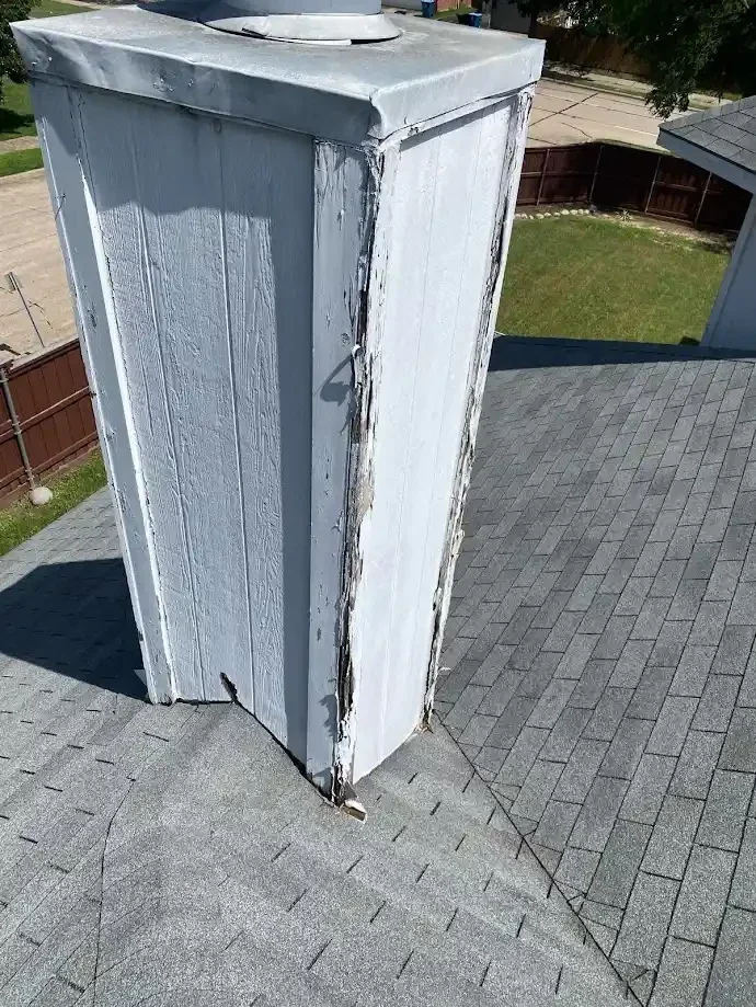 peeling paint on chimney stack
