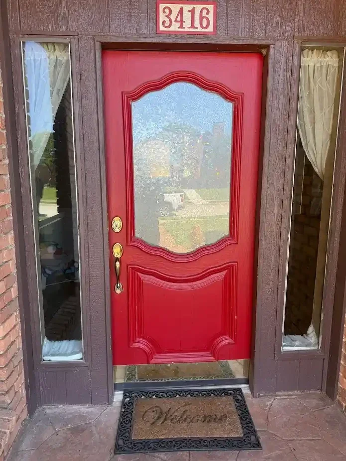 red front door with long door handle
