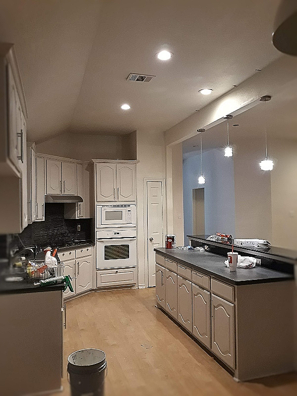 completed repainting kitchen cabinets from black to white