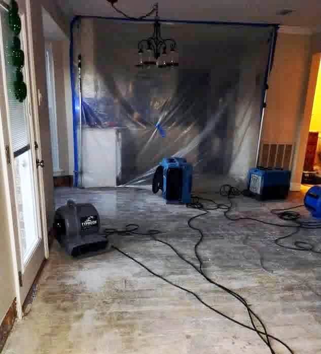 Air scrubbers and dehumidifiers on, with air blowers to circulate the air around a water damaged restoration project