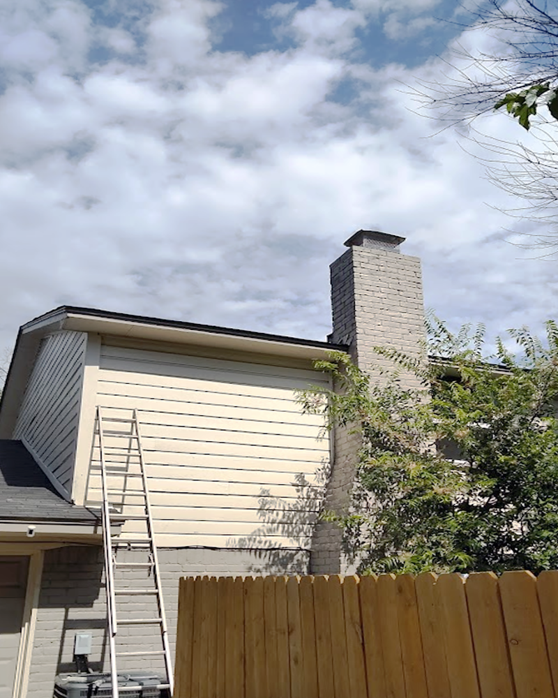Exterior siding painting and chimney brick repair