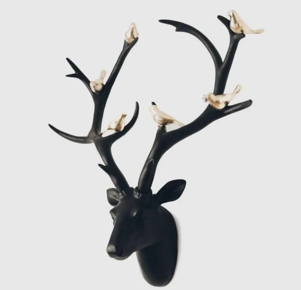Black deer head with birds