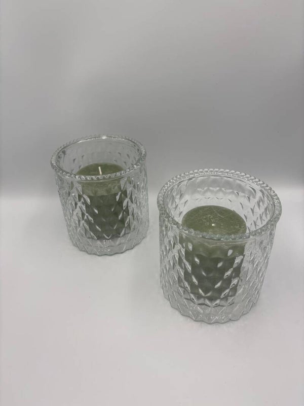 Glazen pot met kaars