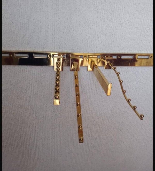 sistema de cremalleras y tiras metalicas con accesorios para tiendas