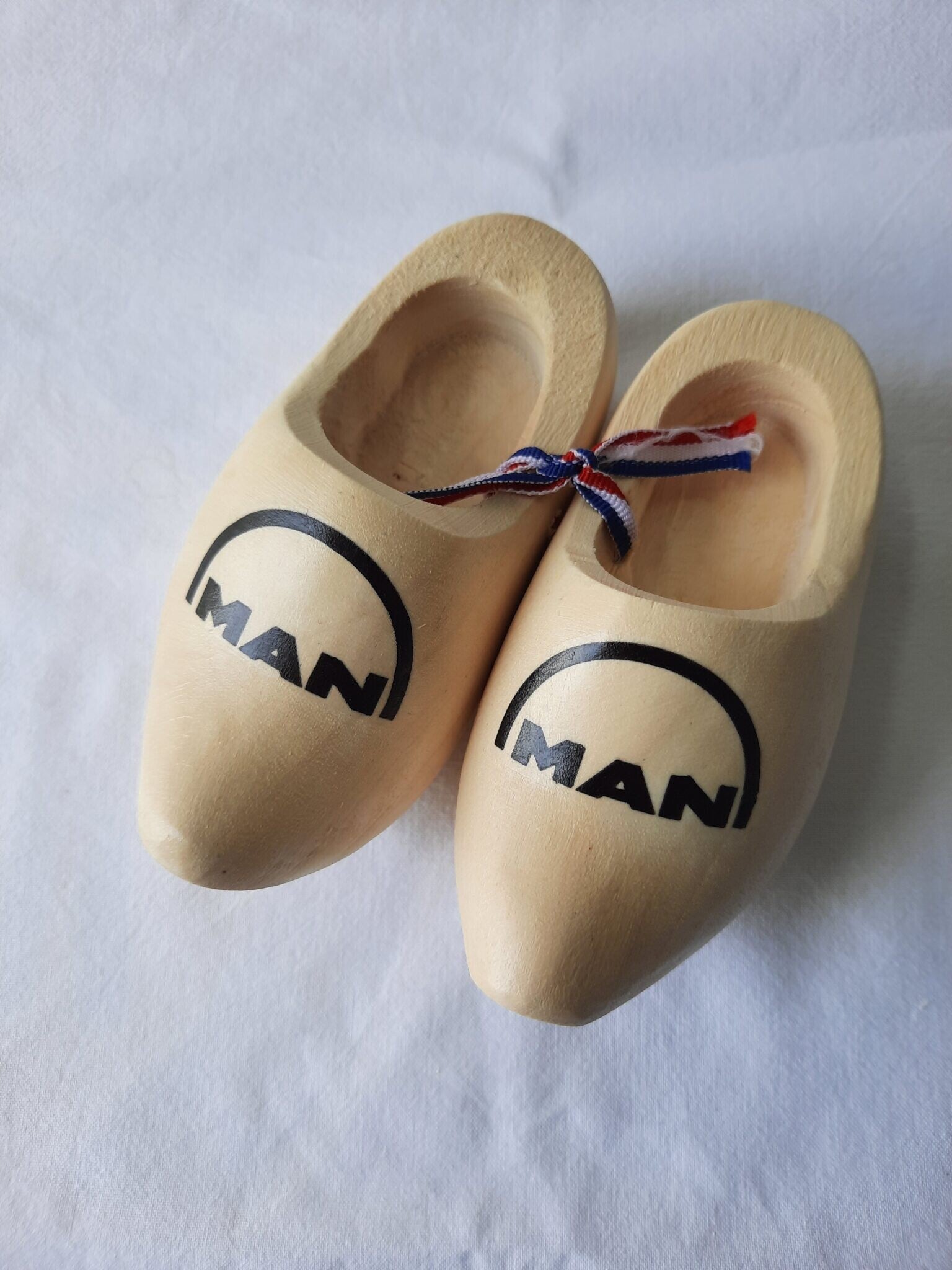 Dashboardklompjes Man Logo