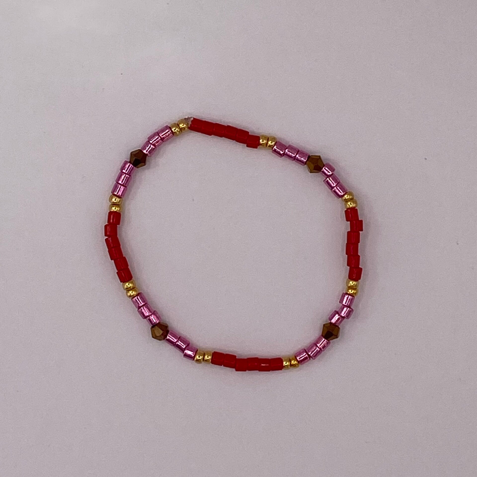 Armbandje rood/roze