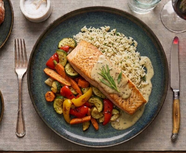 Salmon with tarragon cream sauce, rice and roasted vegetables