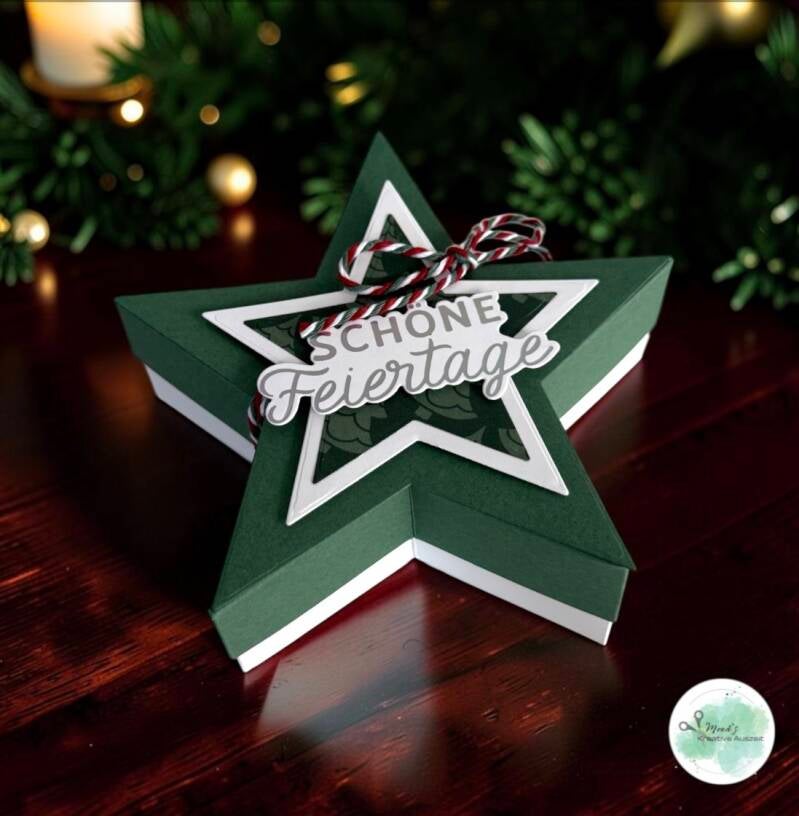 Grüne Sternenschachtel mit weihnachtlichem Schriftzug