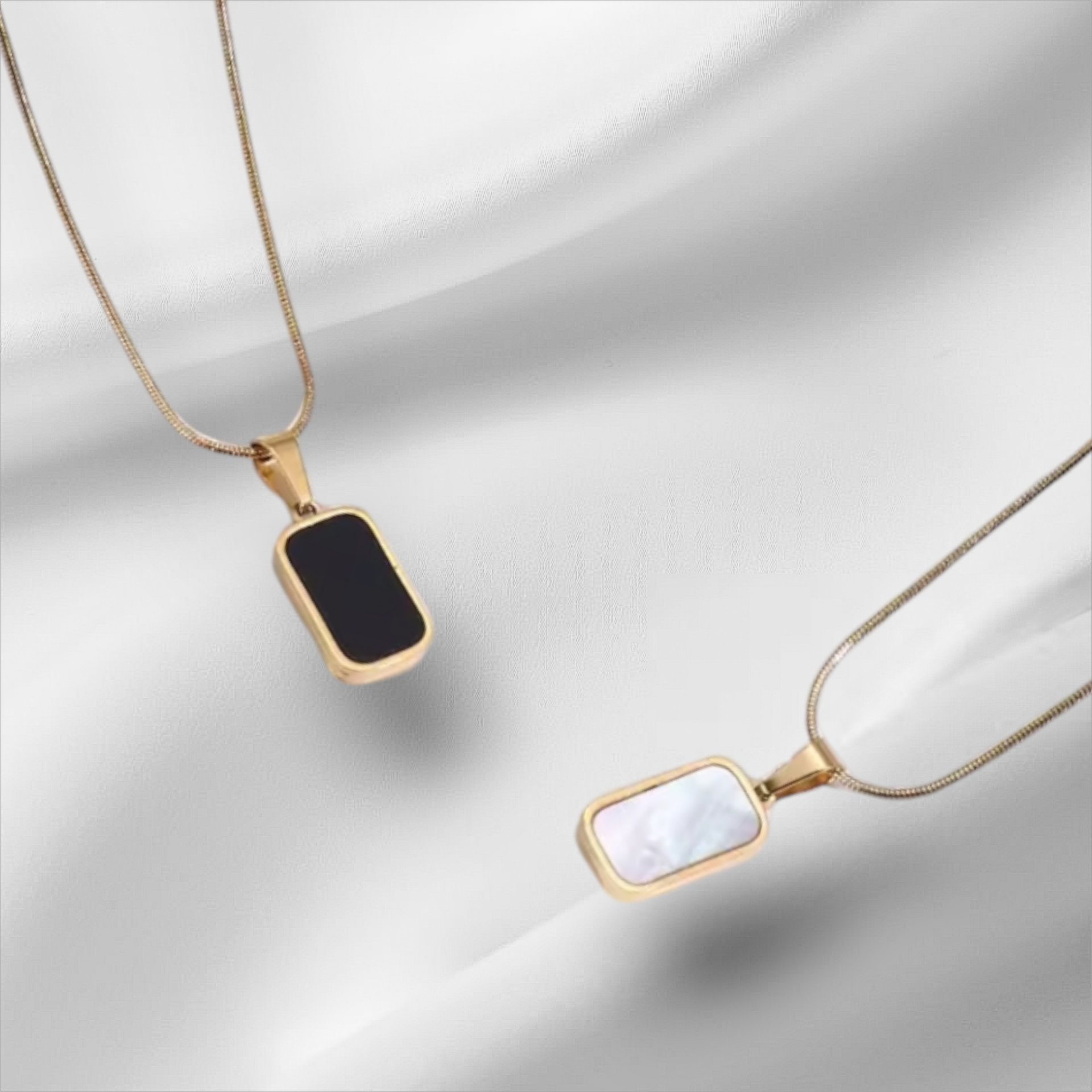 325L stainless steel necklace. White natural shell and double-sided black enamel.