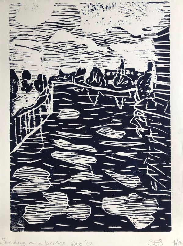 Standing on a bridge