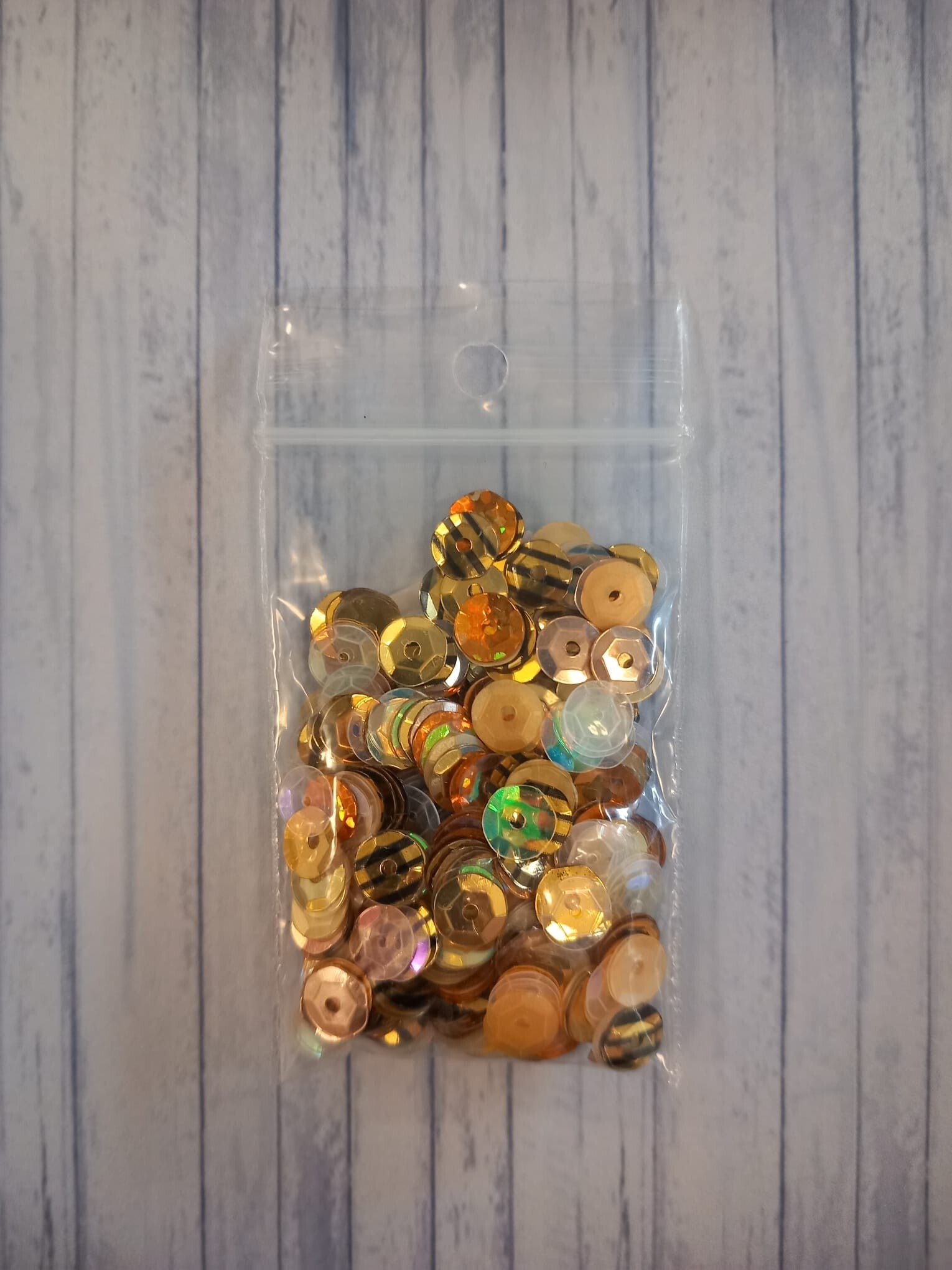 zakje met gemengde pailletten  - goud kleurig