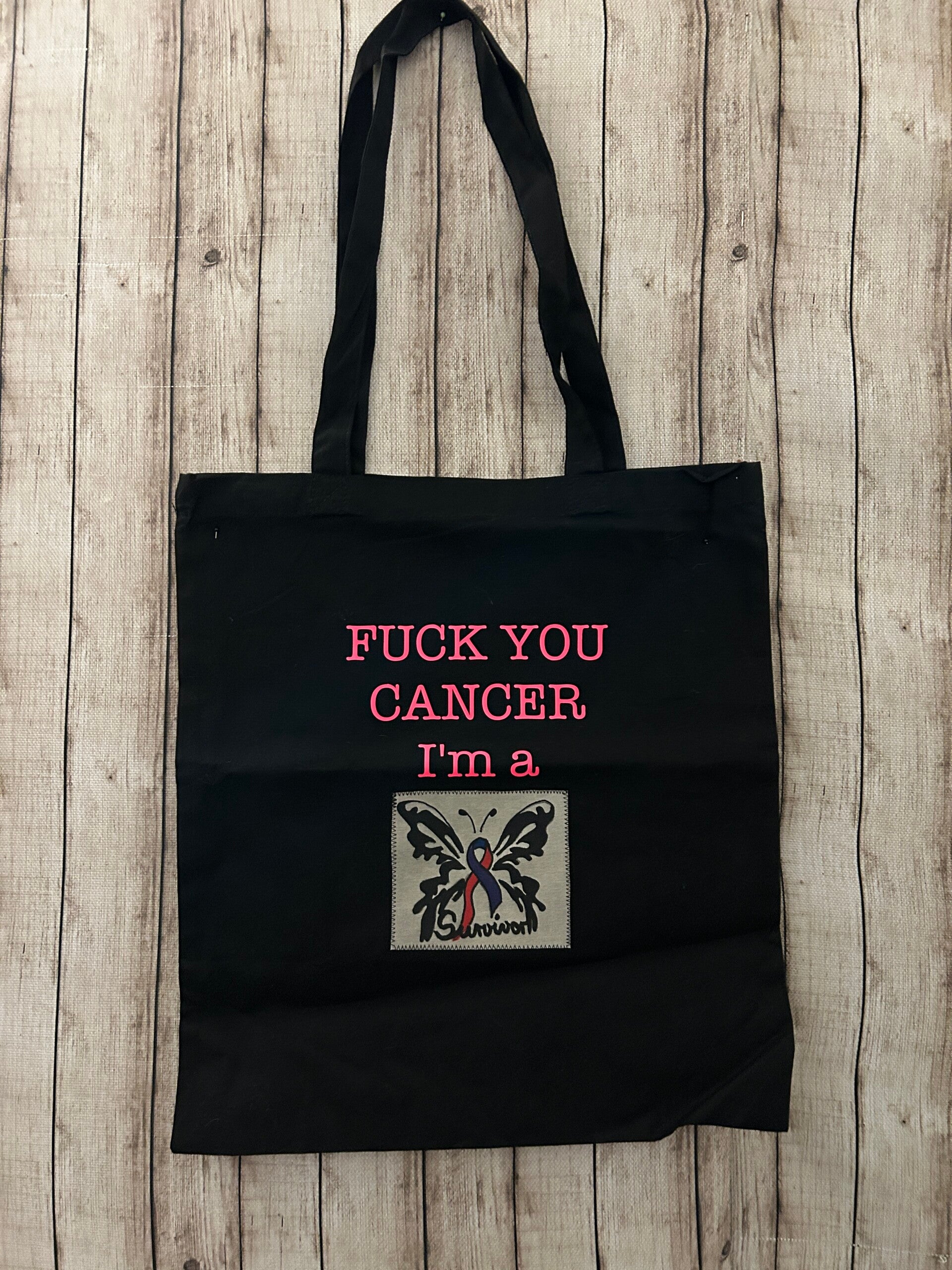Baumwolltasche „Fuck You Cancer – Survivor“ mit Schmetterling – Schwarz