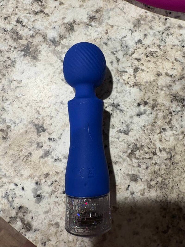 Blue glittery sex toy used
