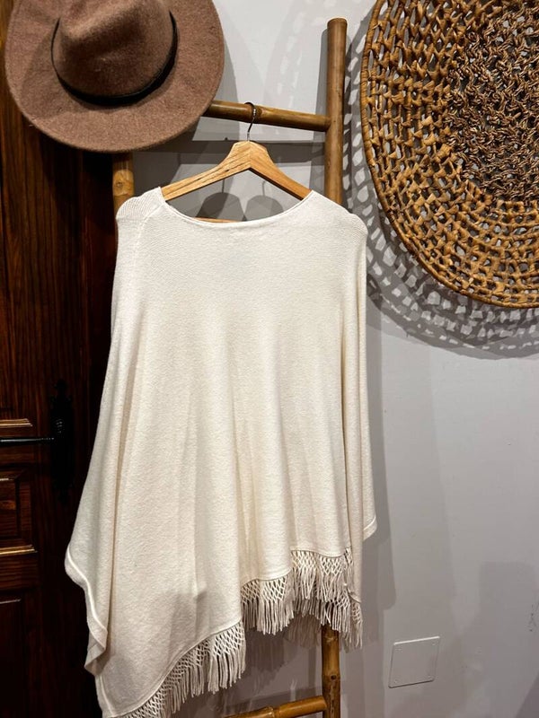 Poncho flecos punto