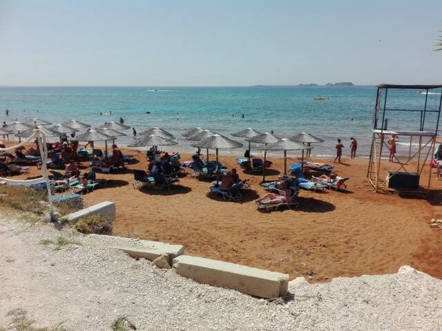 Stand rieten parasols Xi Beach Baywatch beach paliki kefalonia 