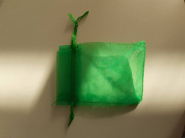 Donker groen orangaza zakje