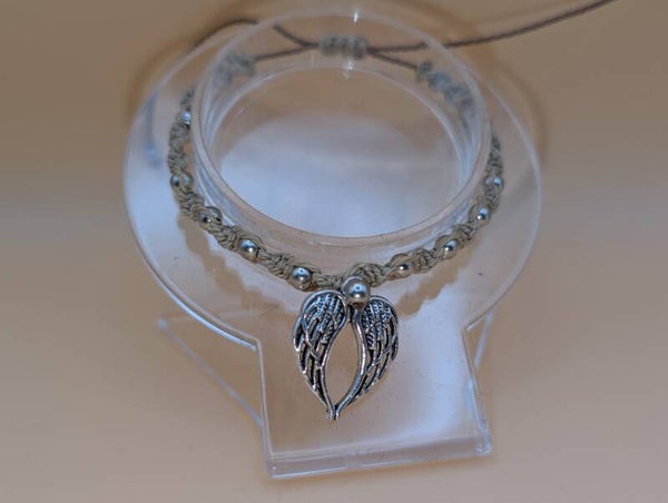Bracelet torsade beige perles argentées insert ailes