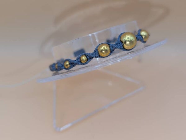 Bracelet torsade perles dorées et fil gris