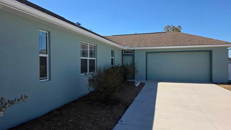 Exterior house painting Punta Gorda Florida by Integrity Painting LLC – front view