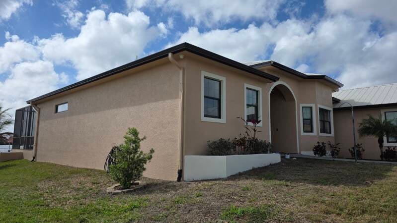 After side elevation Fresh exterior repaint Punta Gorda Florida home by Integrity Painting