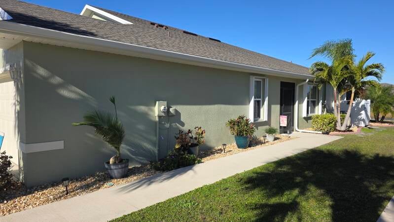 After - Side view - Before and after exterior house painting Port Charlotte Florida