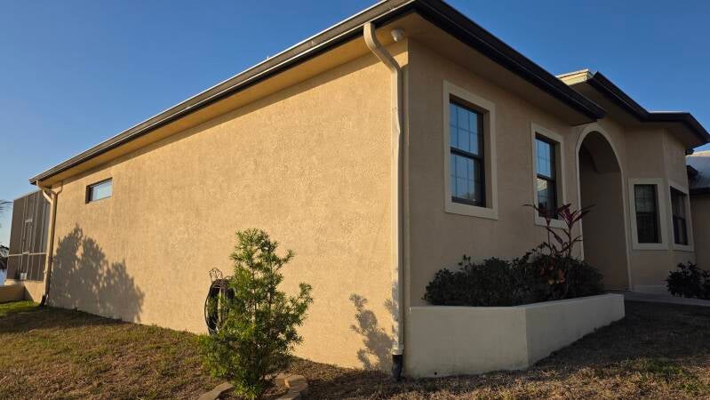 Before side elevation Fresh exterior repaint Punta Gorda Florida home by Integrity Painting