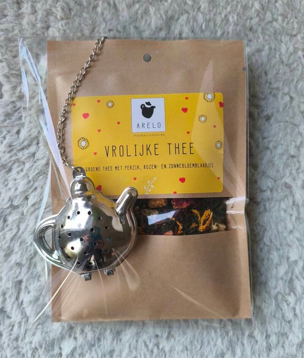 Vrolijke thee met zeefje