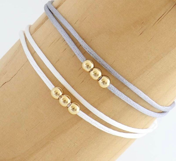 Satijnkoord bolletjes goud