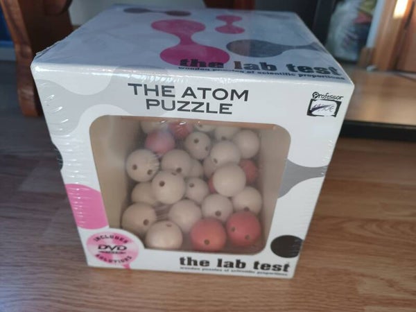 casse tete atom puzzle , neuf
