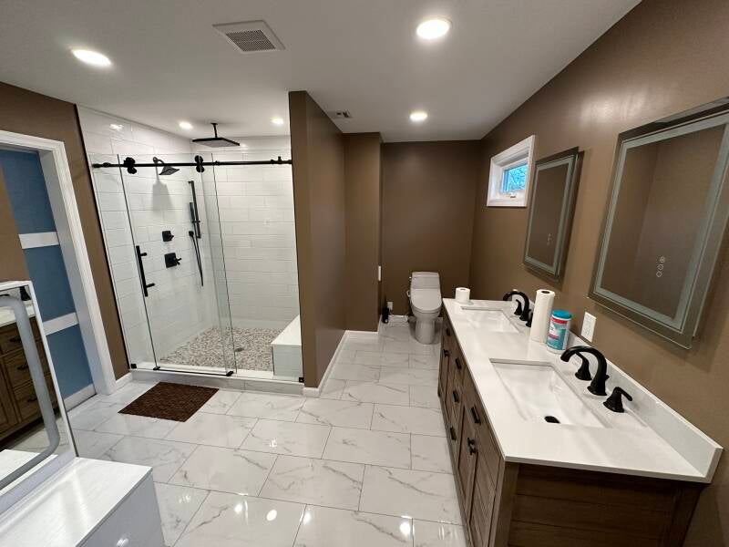Bathroom remodel with oversized walk-in shower, double vanity and neutral finishes in Monmouth County NJ