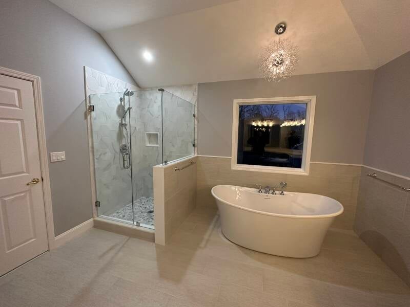 Primary bathroom remodel with freestanding tub, walk-in shower and neutral tile finishes in Monmouth County NJ