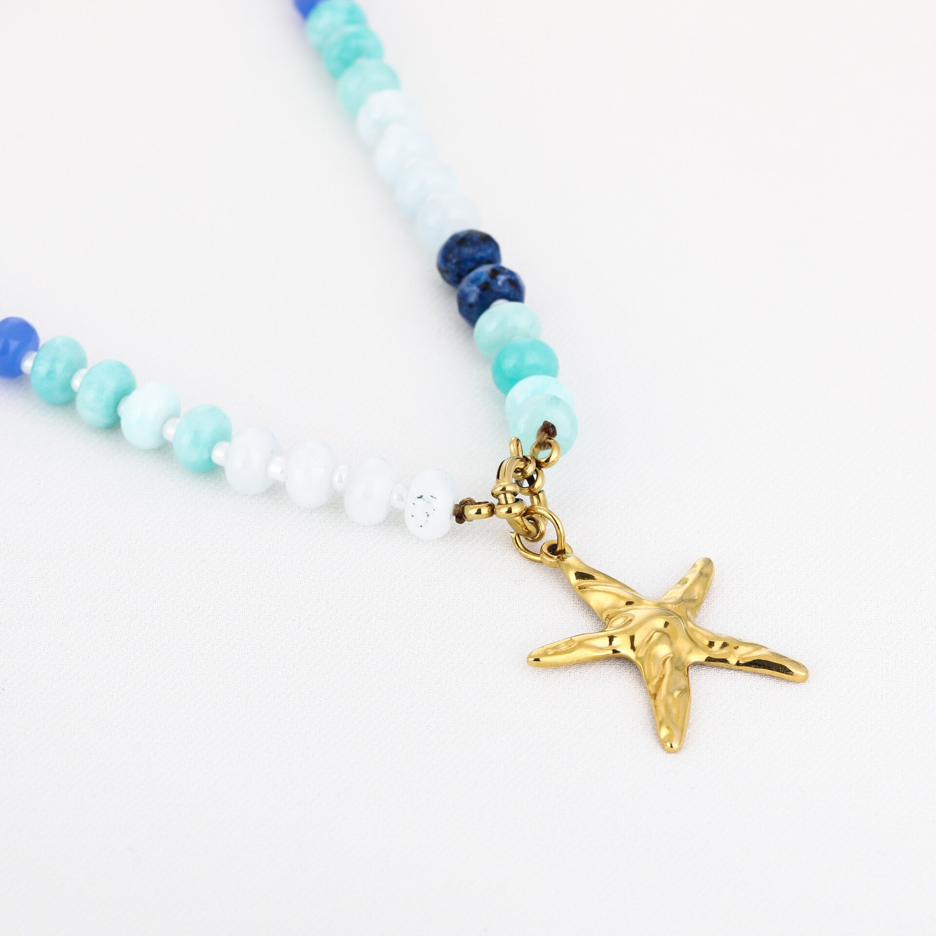 Blue sea star ketting goud