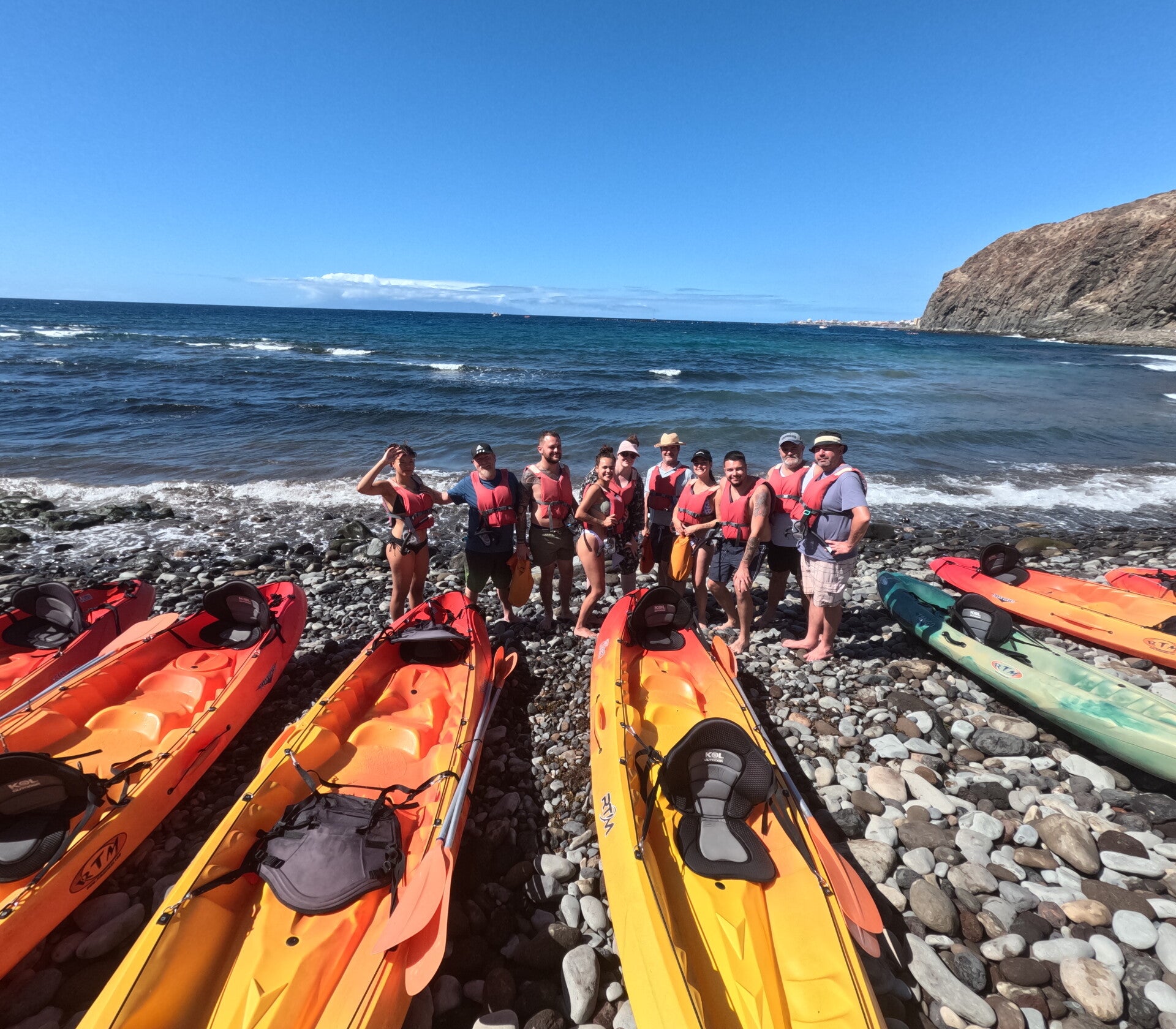 group of customers leaving from the sandy beach
