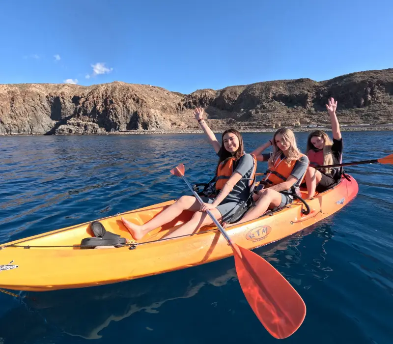 smiling girls kayaking in Tenerife