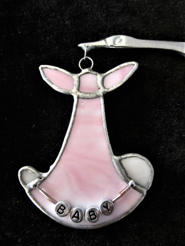 Ooievaar met baby - rose