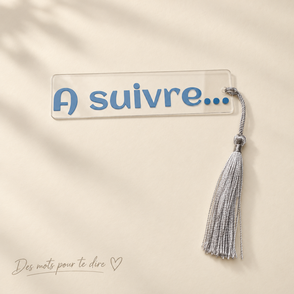 Marque-page transparent « À suivre… » bleu avec pompon argenté