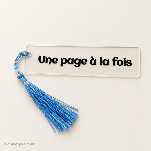 Marque-page transparent « Une page à la fois » – Pompon bleu