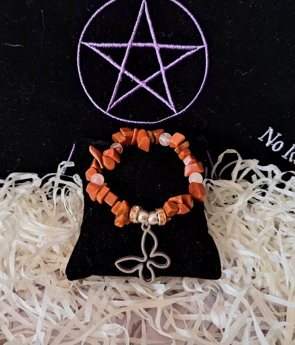 pulsera transformación con gemas goldstone y cuarzo rosa