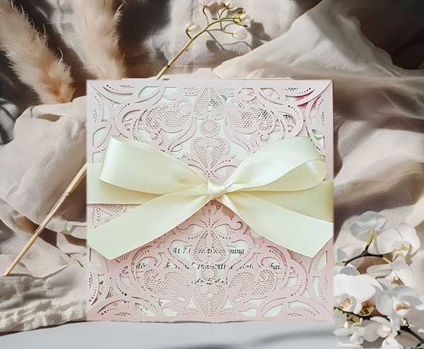Blush pink lace invitation with satin ribbon bow