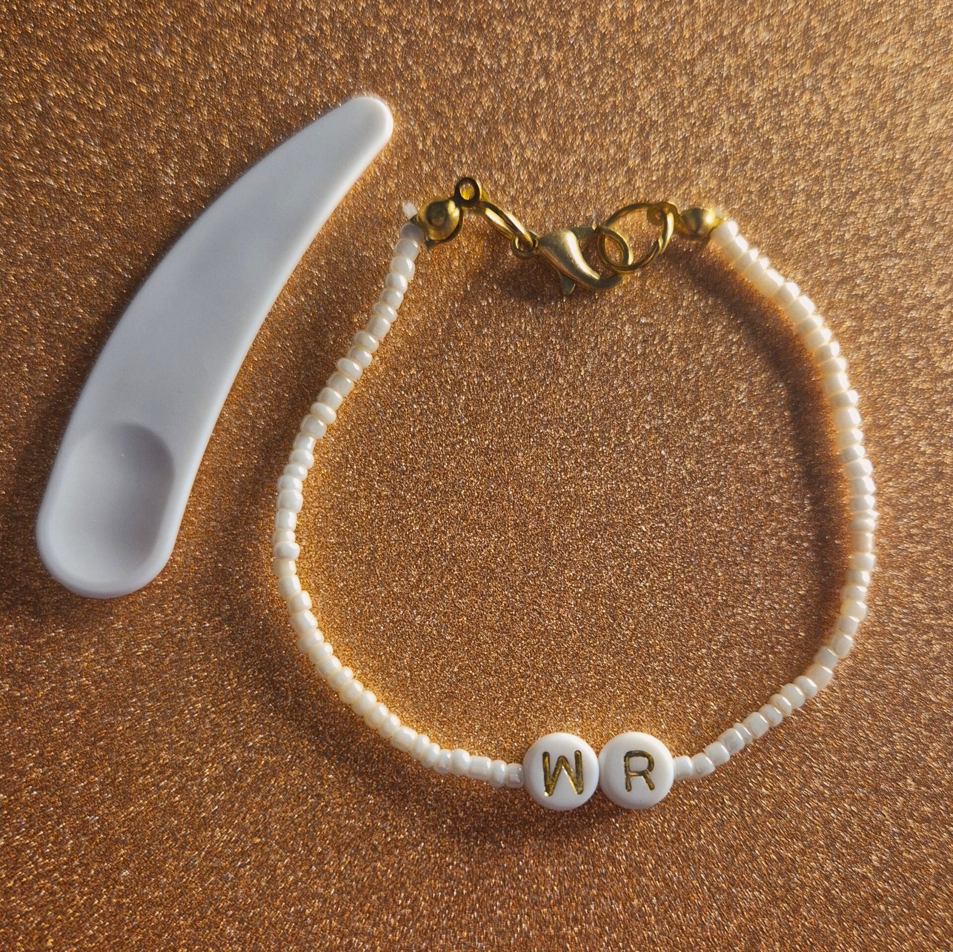 Beige wildflower kralen armband  + cosmetische lepel