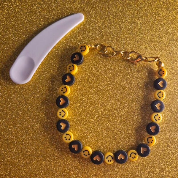 Smiley armband + cosmetische spatel