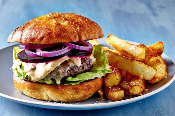 Fully  stacked burger with chips and any drink