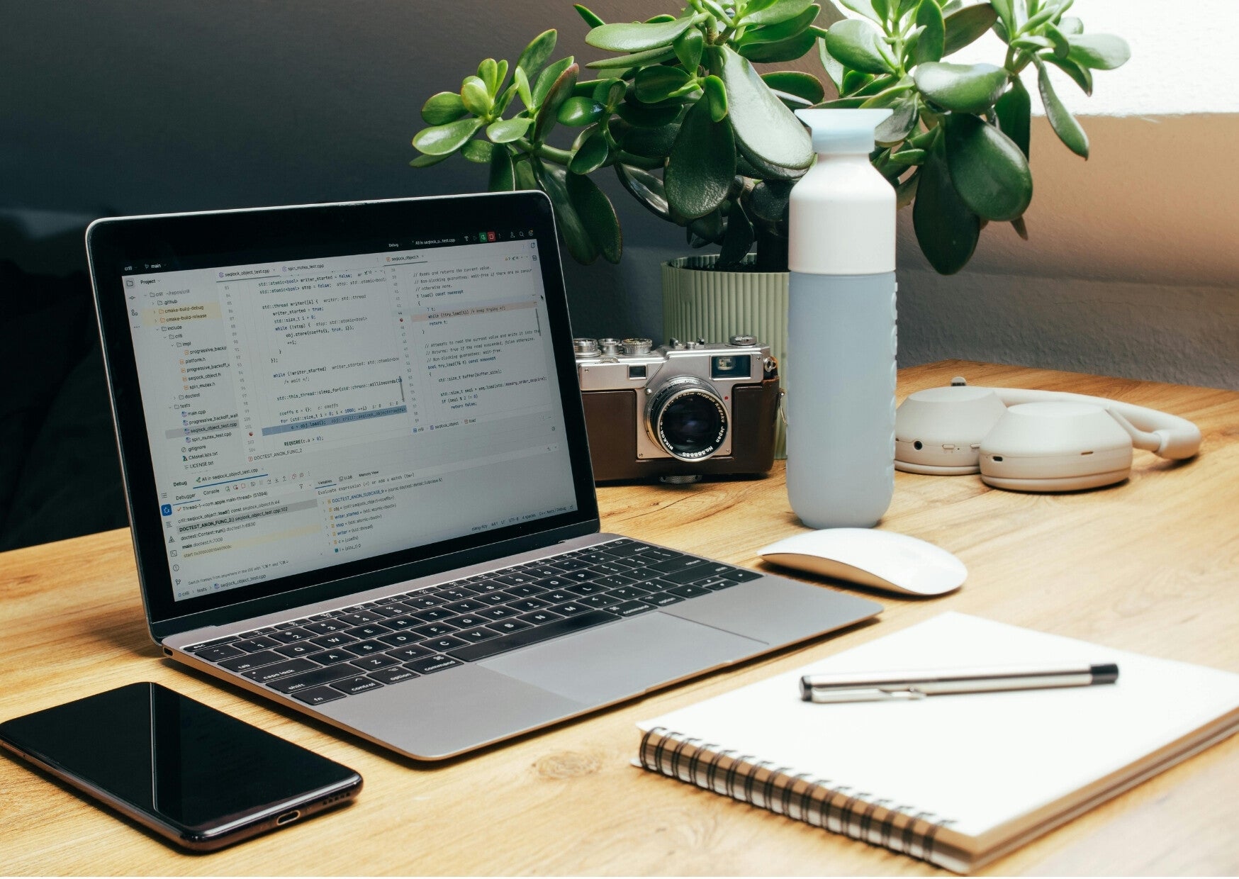 Flexible workspace with a laptop and office equipment arranged on a desk.