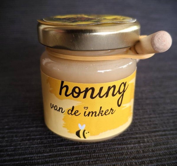 Voorjaarshoning (crème) met honinglepeltje