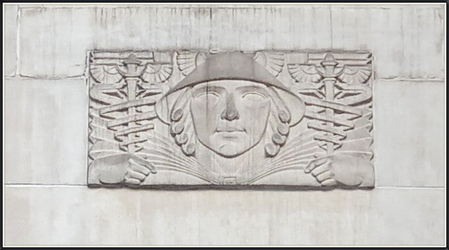 Bas-relief of Mercury with winged helmet and caduceus in each hand.