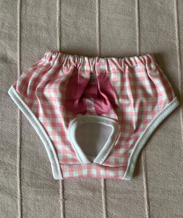 Braguita de cuadros rosa con lazo fucsia