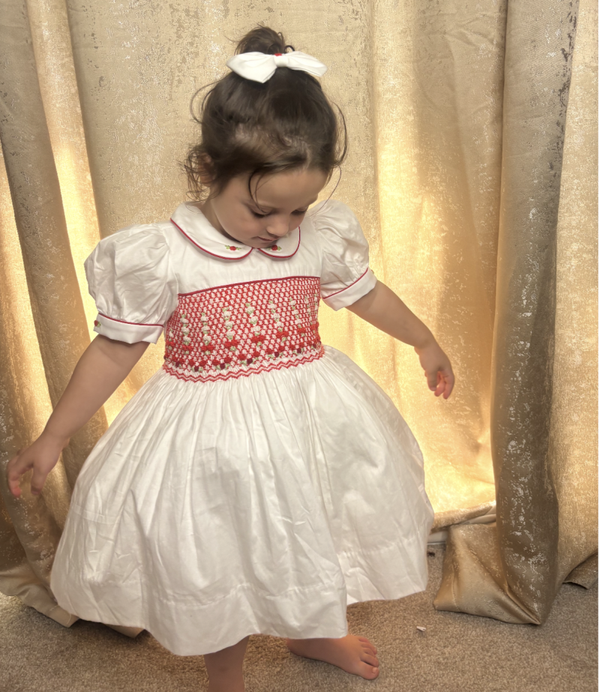White and red smocked dress.
