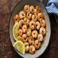 tasty-appetizing-fried-shrimps-pan-dark-stone-background-top-view-standard-qdxu5t.jpg